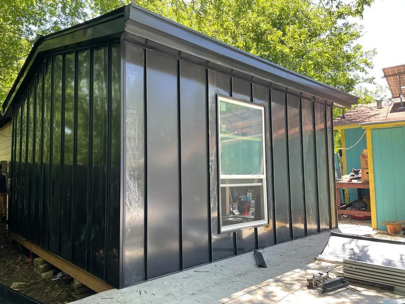 Black standing seam metal wall panels for Roof Inspection in Port Townsend