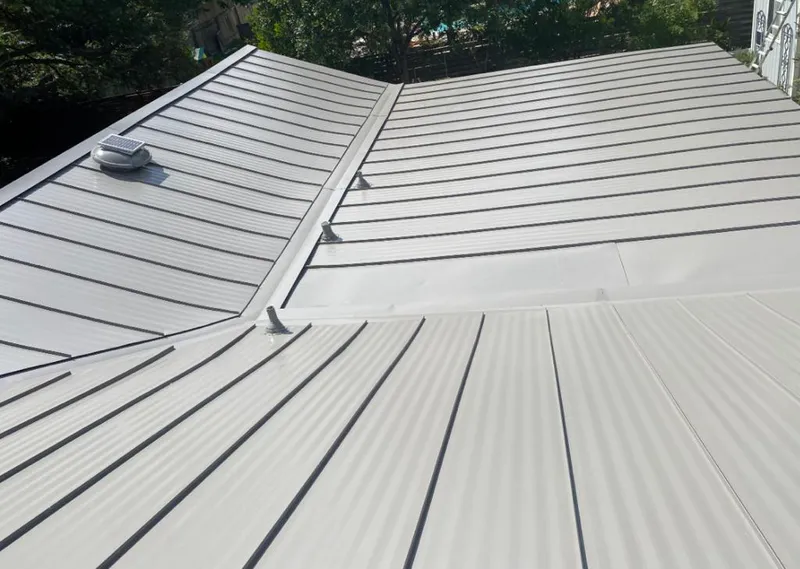 Solar attic fan installed on a metal roof for Roof Ventilation in Port Townsend